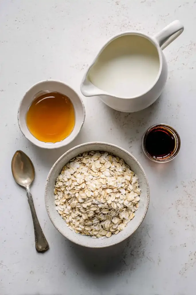 Basic ingredients for easy overnight oats laid out on kitchen surface