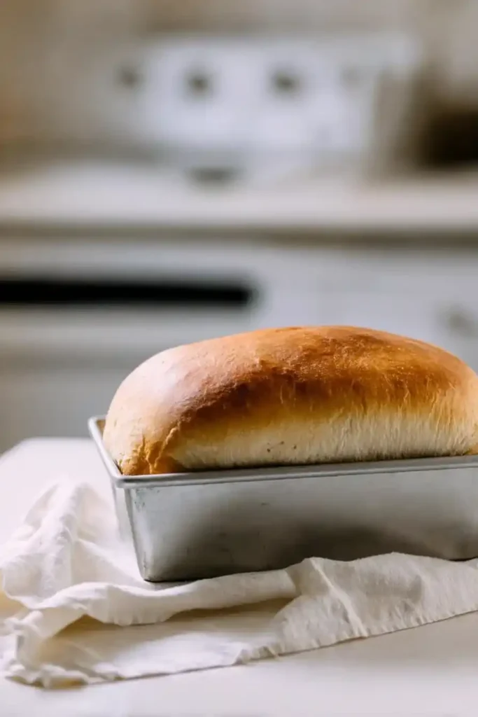 sourdough sandwich bread loaf on white kitchen counter