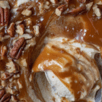 Close-up of easy caramel apple cheesecake dip recipe with caramel swirls and pecans.