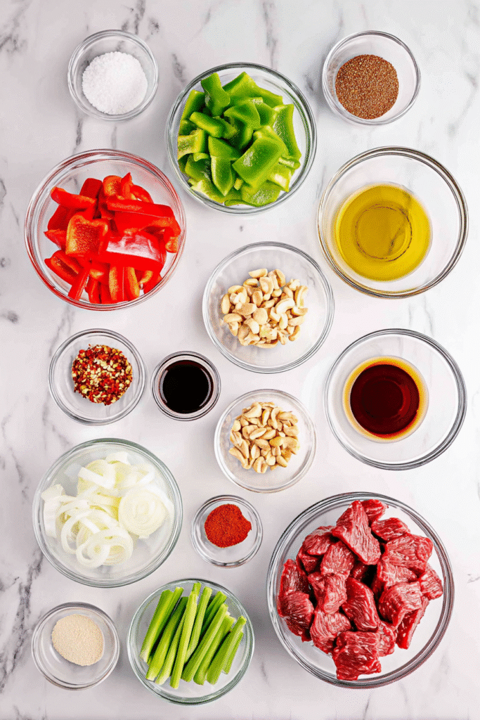 Kung Pao Beef ingredients laid out in bowls on a marble surface