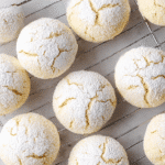 These cream cheese cookies are soft, tender, and topped with powdered sugar for a melt-in-your-mouth treat. Perfect for any cream cheese cookie lover!