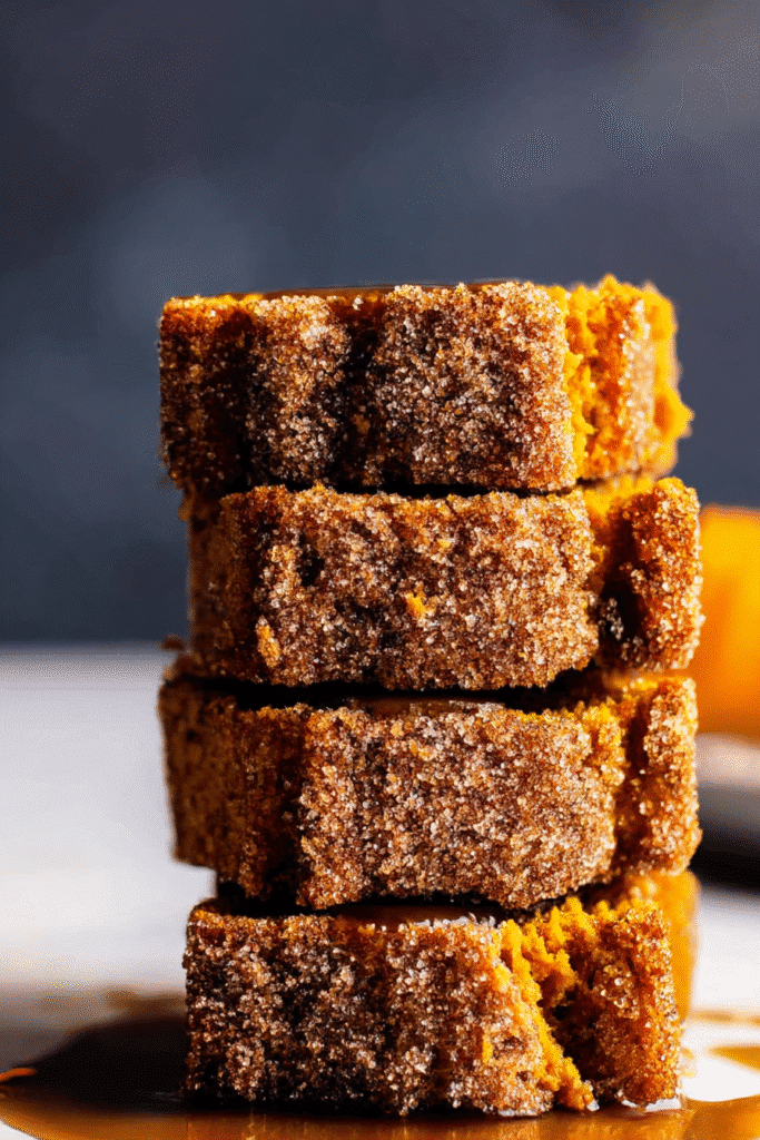 Stacked cinnamon swirl pumpkin bread slices. Homemade, moist pumpkin bread dessert.
