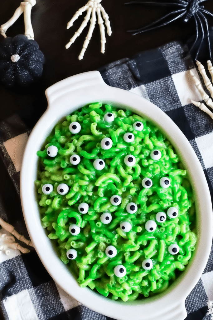 Monster mac and cheese in bright green color with candy eyeball