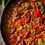 Cowboy Butter Chicken stew with beans, peppers, and a rich tomato sauce.