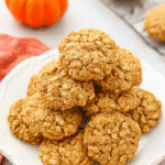 easy Pumpkin oatmeal cookies on a decorative white plate, surrounded by fall-themed kitchen decor.