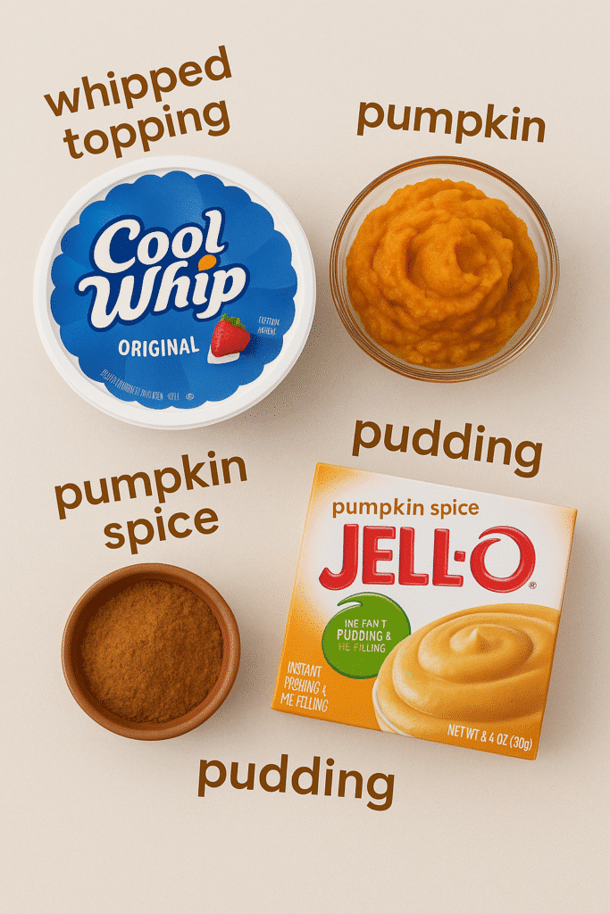Flat lay of labeled Pumpkin Fluff Pie ingredients: whipped topping, pumpkin puree, pumpkin spice, and vanilla pudding mix.