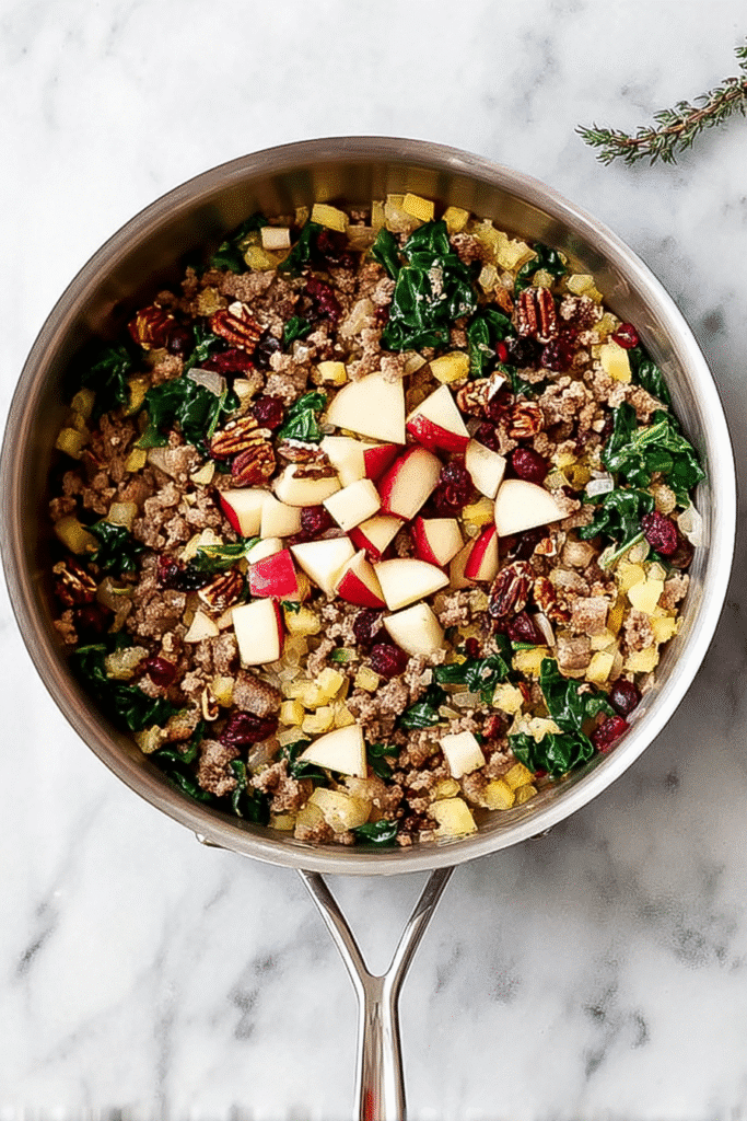Mixing the Apple Sausage Filling for Stuffed Butternut Squash