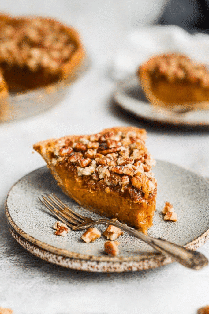 Perfectly Plated Slice of Praline Pumpkin Pie with Crunchy Pecan Top