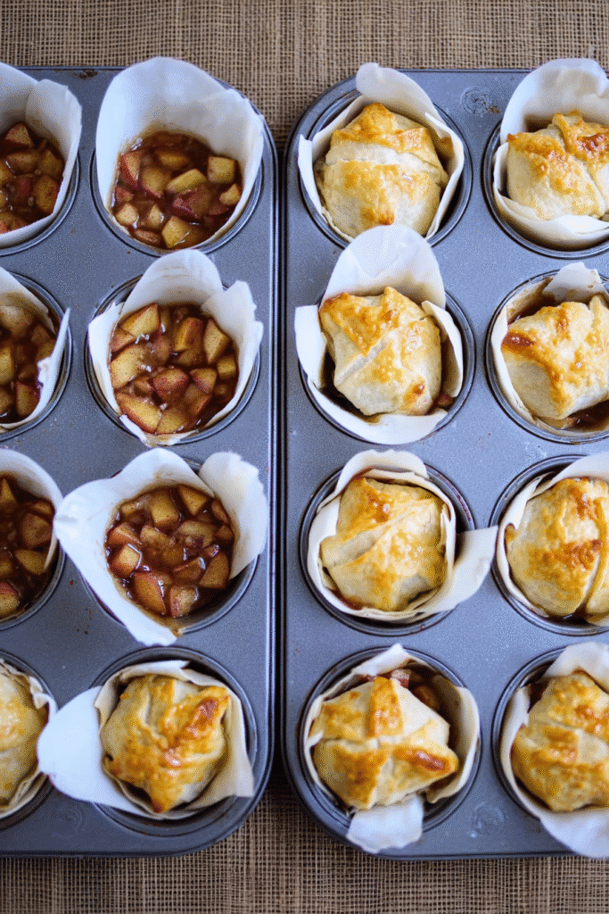 mini apple pies with apple filling in puff pastry before baking