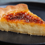 Slice of Creme Brulee Pie with caramel top and creamy custard filling