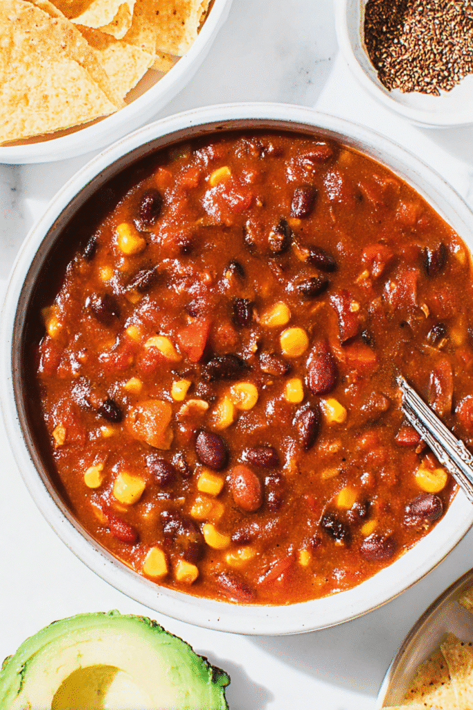 This vegetarian chili recipe is loaded with beans, corn, and bold spices in a rich tomato base, making it a cozy and satisfying meatless meal.
