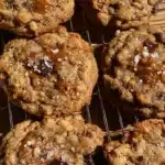freshly baked apple cider caramel cookies with caramel swirls and sea salt