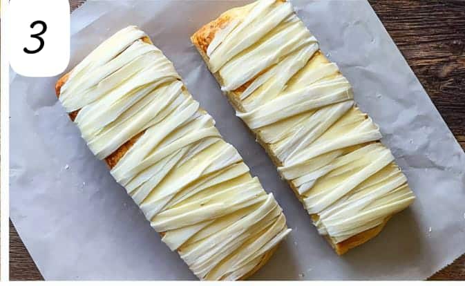 Halloween mummy cheese bread. Garlic bread wrapped in cheese strips before baking. Mummy bread recipe.