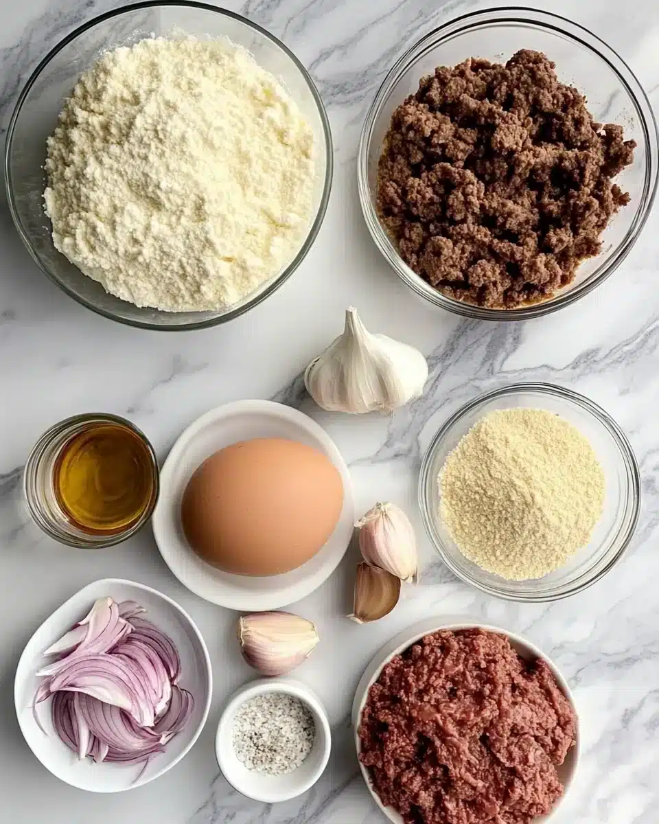 Essential Ingredients for Amish Hamburger Steak Bake Amish Hamburger Steak Bake ingredients including ground beef and onions.