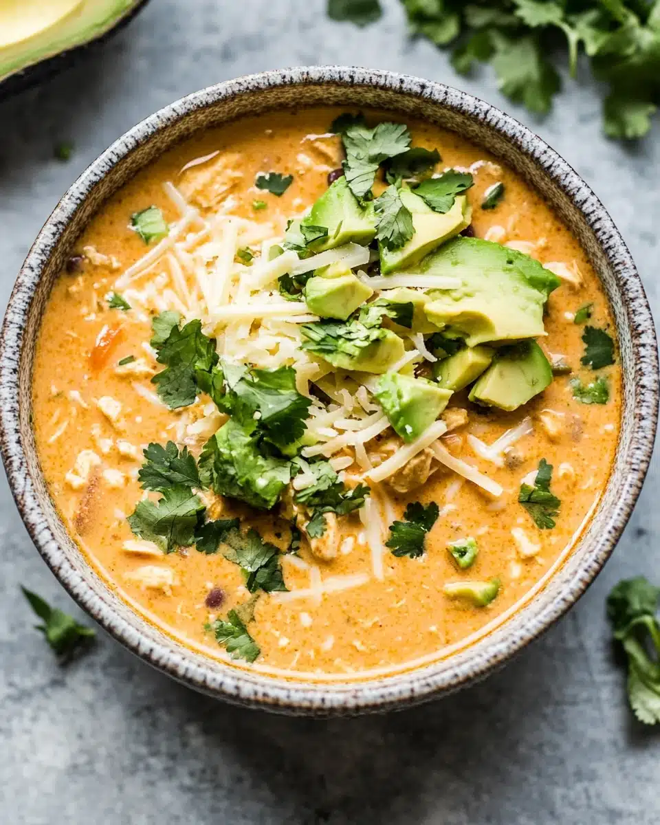 Delicious creamy white chicken chili with toppings ready to enjoy