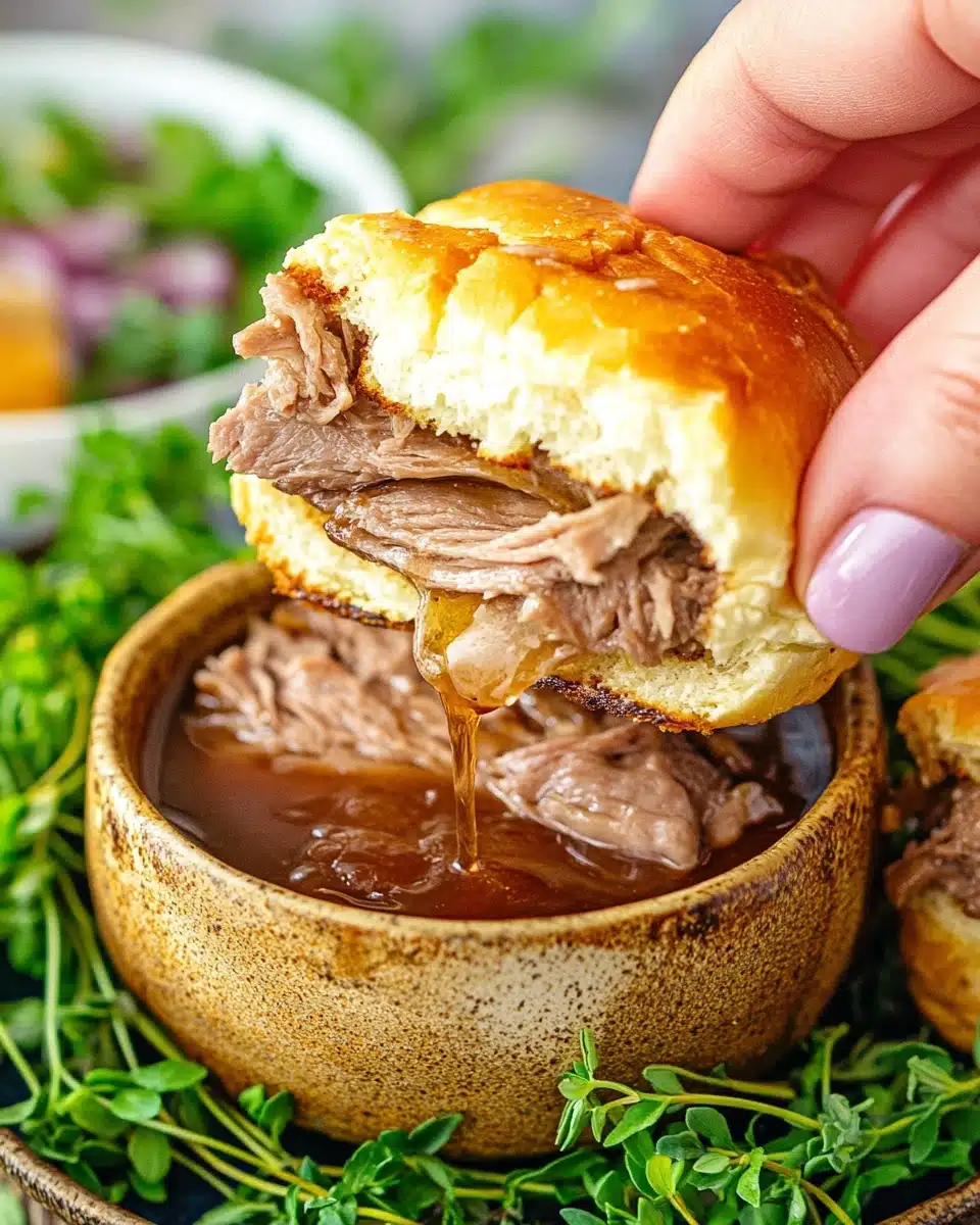 Delicious french dip sliders ready for dipping with au jus.