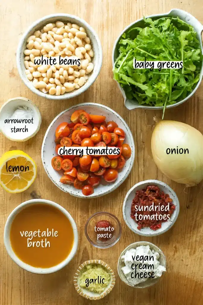 creamy tomato white bean stew ingredients in pan