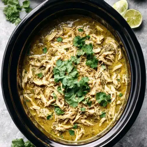 Delicious crockpot salsa verde chicken ready to serve.
