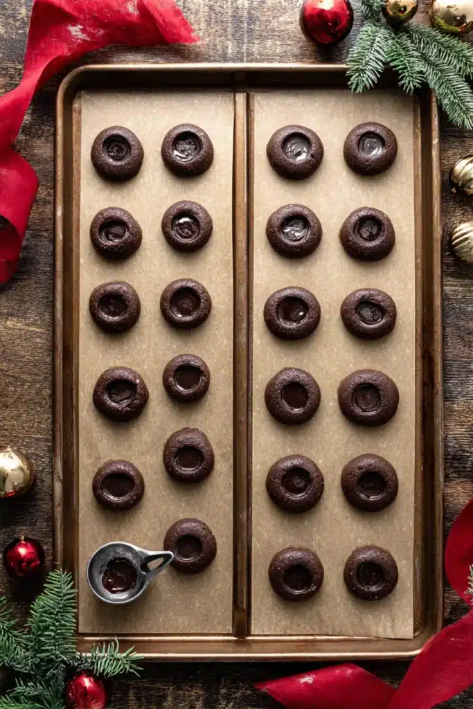 shaping chocolate thumbprint cookie dough with scoop