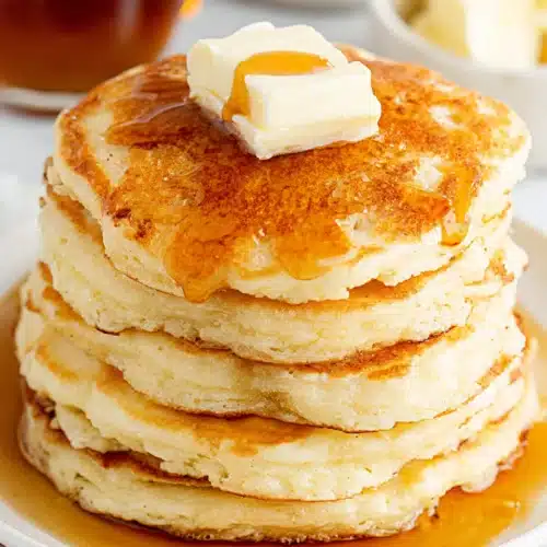 Delicious best fluffy pancakes drenched in syrup