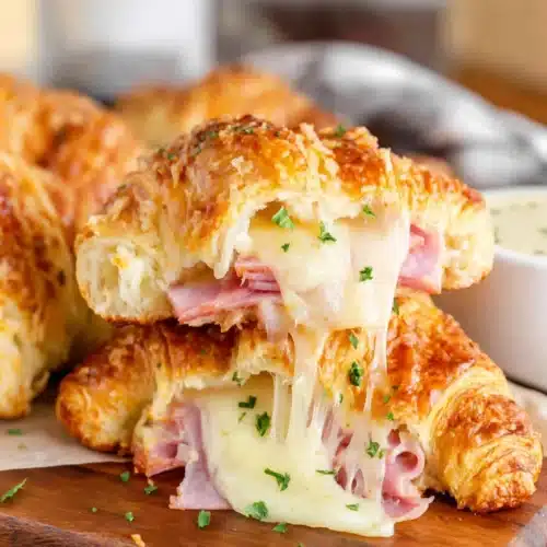Irresistible cheese croissants filled with savory ham and melted cheese.