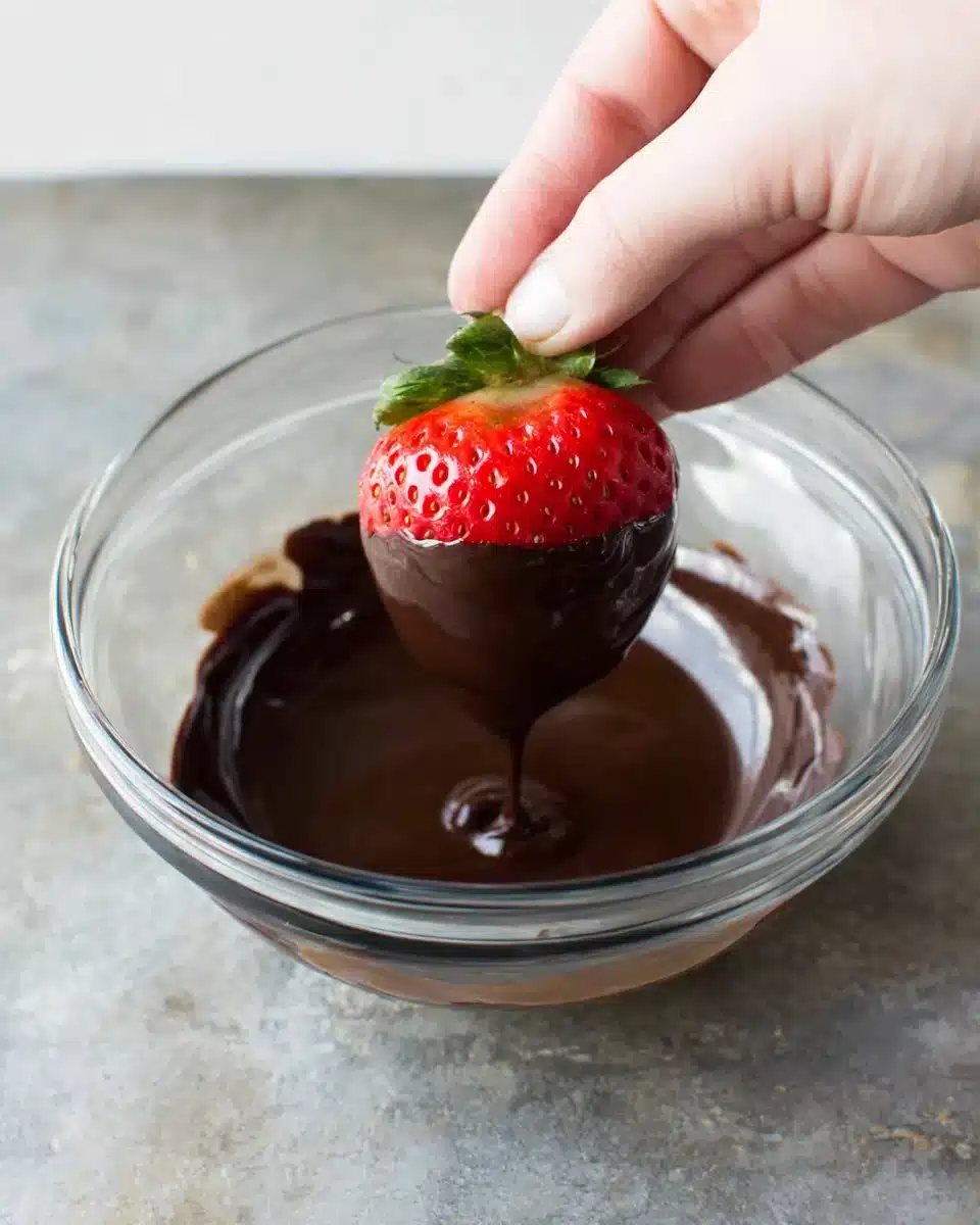 Chocolate Covered Strawberries in the Making Delicious chocolate covered strawberries recipe preparation in action.