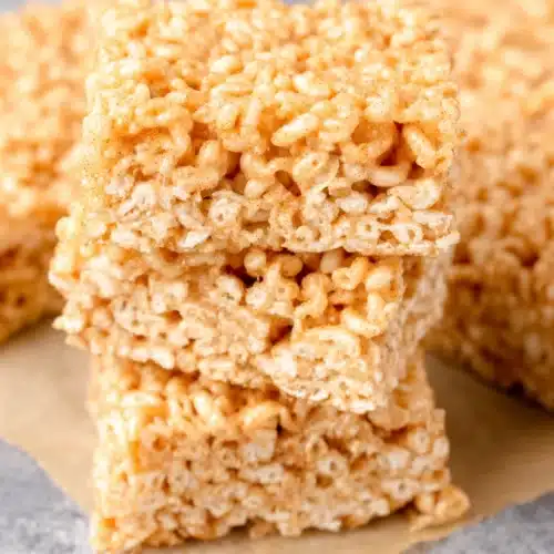 Churro Rice Krispie Treats stacked high for a sweet treat.