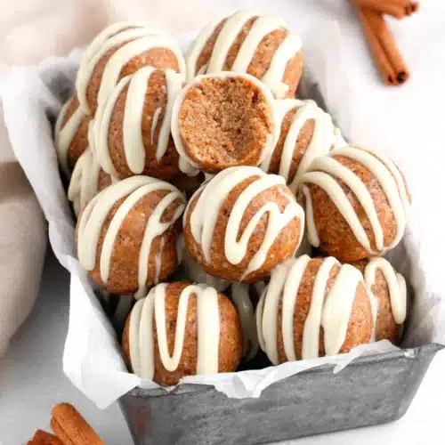 Cinnamon Roll Protein Balls on a tray, ideal healthy snack.