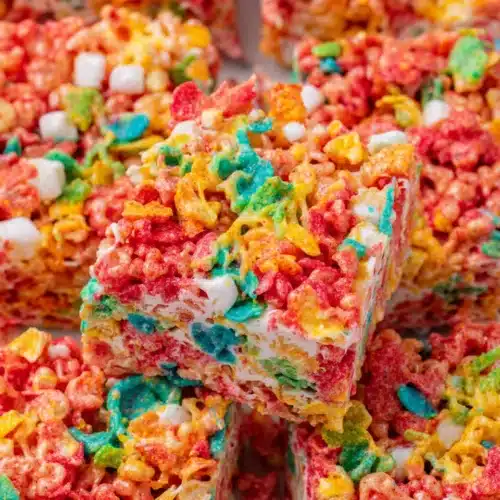 Colorful Fruity Pebbles Rice Krispie Treats with gooey marshmallow.