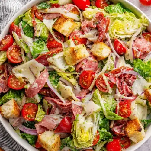 Colorful grinder salad with fresh vegetables and Italian meats.