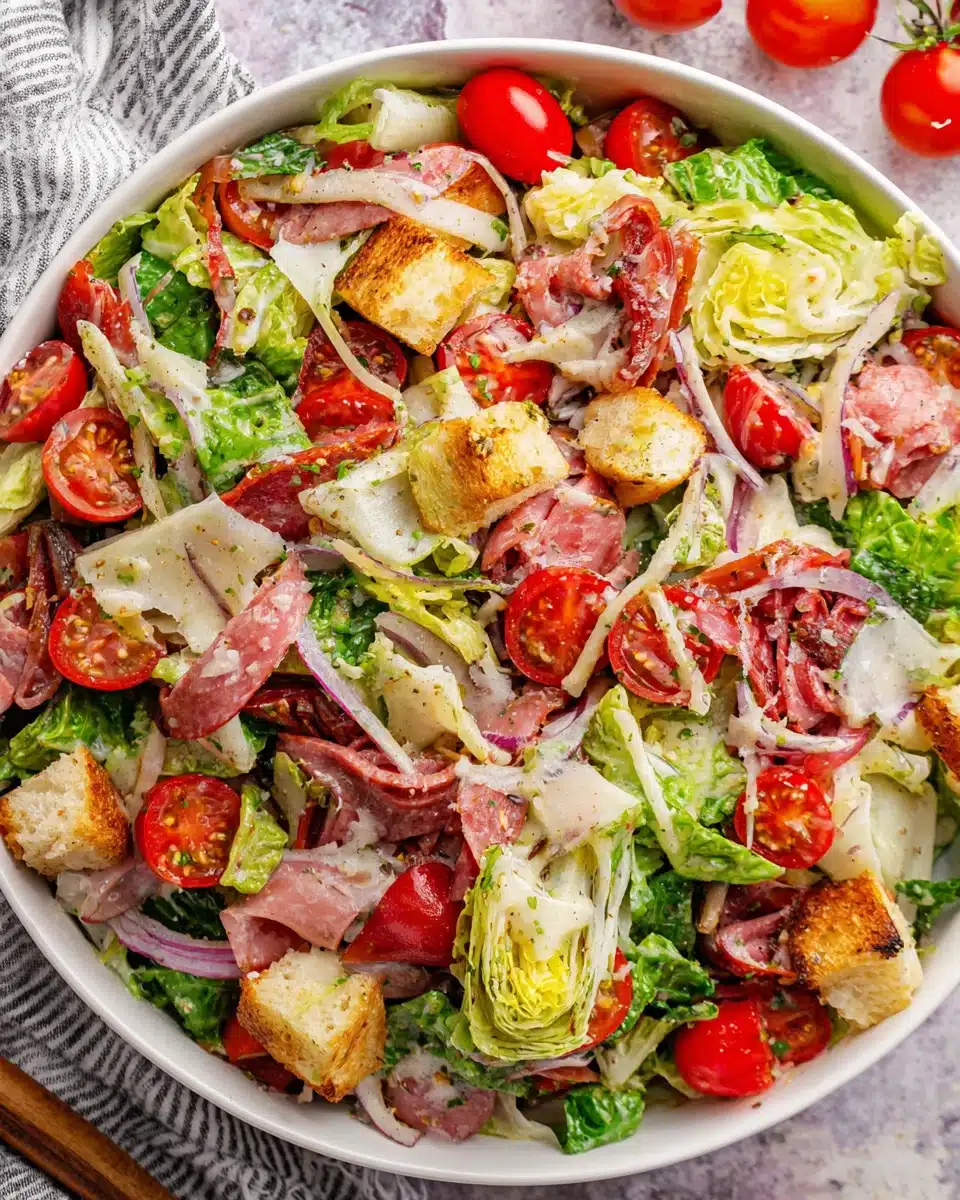 Colorful grinder salad with fresh vegetables and Italian meats.