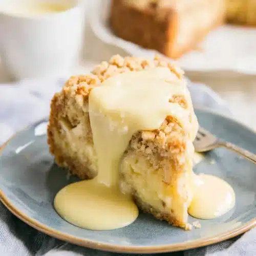 Delicious Irish Apple Cake served with custard sauce.