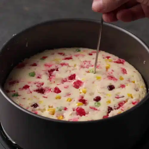 Delicious rava cake with tutti frutti, perfect for any occasion.