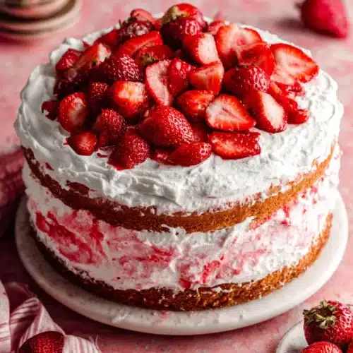 Delicious Strawberry Shortcake Cake with vibrant strawberries on top.