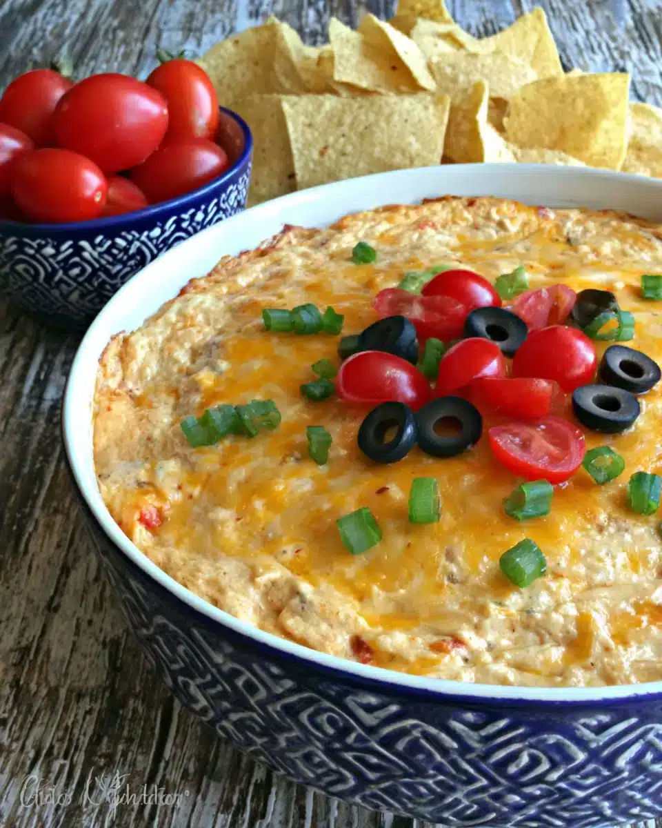 Texas Trash Dip (Warm Bean Dip) with tortilla chips for dipping
