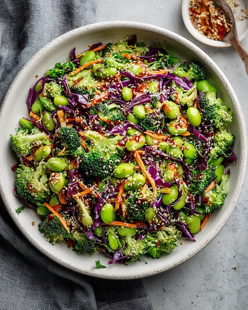 Colorful broccoli salad with edamame, carrots, and sesame seeds.