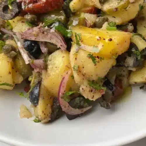 Mediterranean inspired potato salad with herbs and vegetables