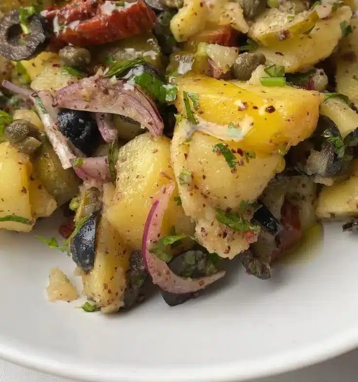 Mediterranean inspired potato salad with herbs and vegetables