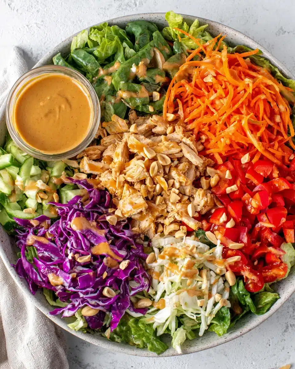 Peanut chicken crunch salad with vibrant veggies and creamy peanut dressing.