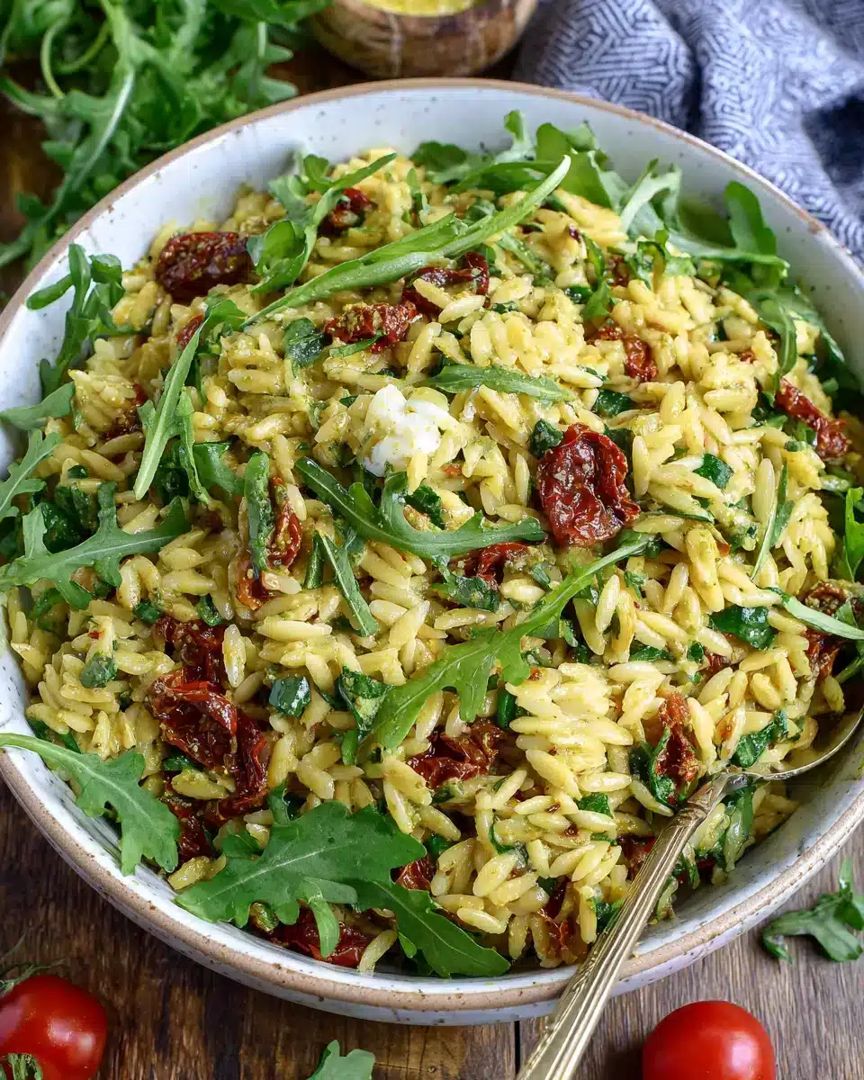 Delicious pesto orzo salad with sun-dried tomatoes, perfect for spring.