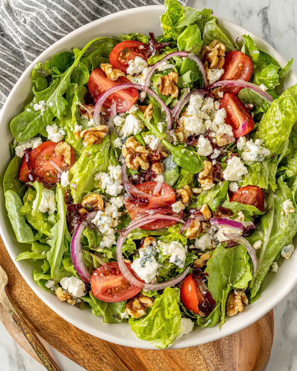 Delicious spring mix salad with fresh ingredients including feta and walnuts.