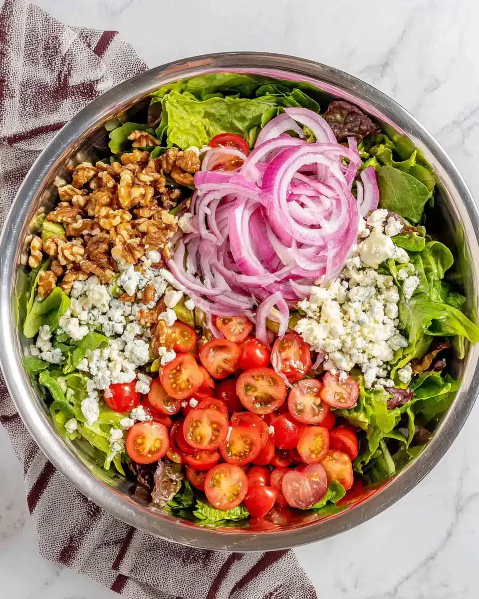Vibrant spring mix salad with fresh ingredients and feta cheese.
