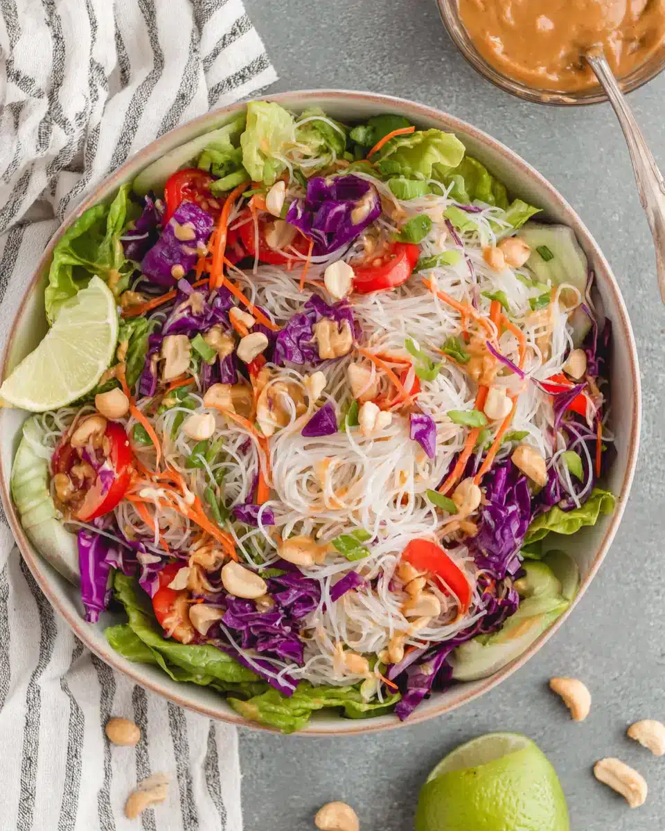 Delicious spring roll salad with peanut sauce, vibrant and fresh.