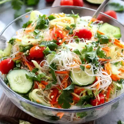 Refreshing spring roll salad with spicy ginger dressing for any occasion.