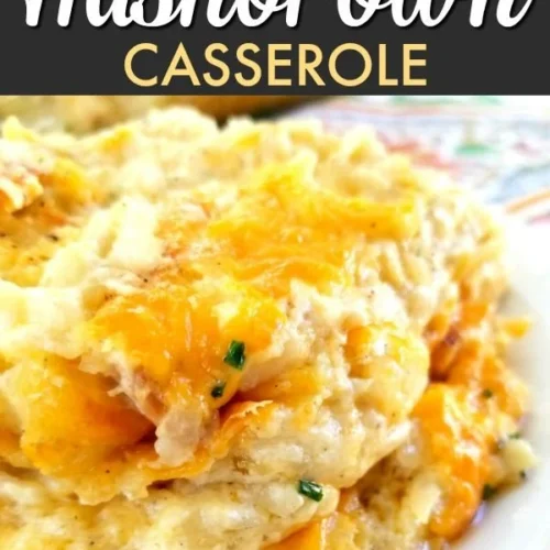 Jar of homemade Apple Pie Moonshine with apples and spices surrounding it.