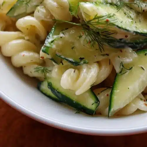 Delicious cucumber pasta salad with fresh vegetables and dressing