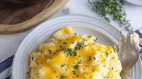 Easy and delicious Crockpot Hashbrown Casserole recipe with creamy cheese and potatoes.