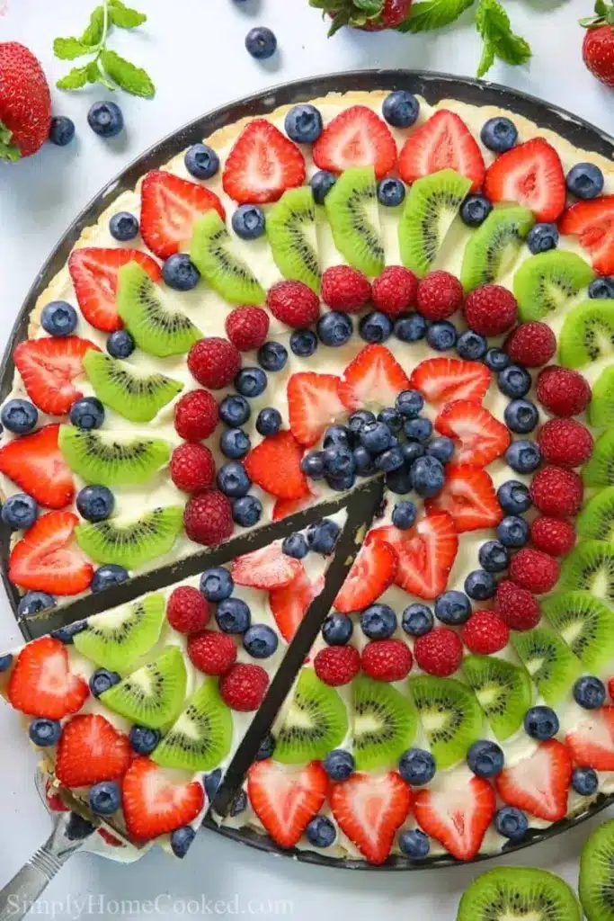 Delicious easy fruit pizza with fresh fruit toppings and a cookie crust
