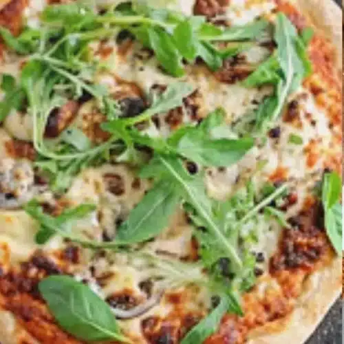 Gluten-free sourdough pizza crust topped with fresh ingredients