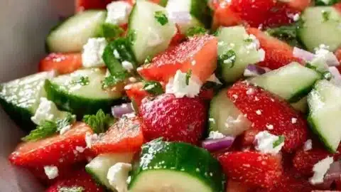 Refreshing cucumber strawberry feta salad with vibrant colors and textures.